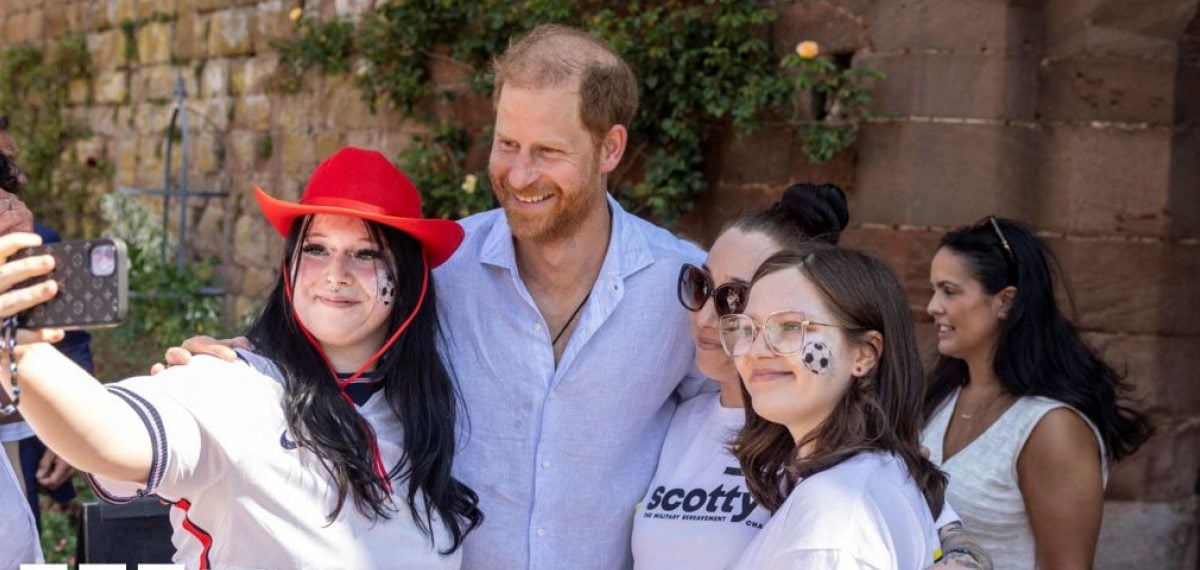 Prince Harry comforts bereaved children at Scotty’s Little Soldiers festival